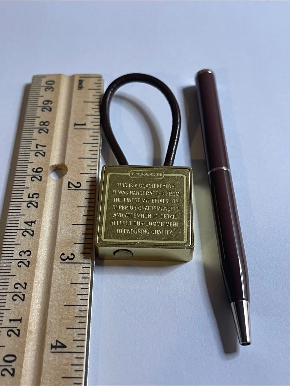 Coach Gold-Tone Brass Key Fob with Brown Leather Loop and Coach Pen